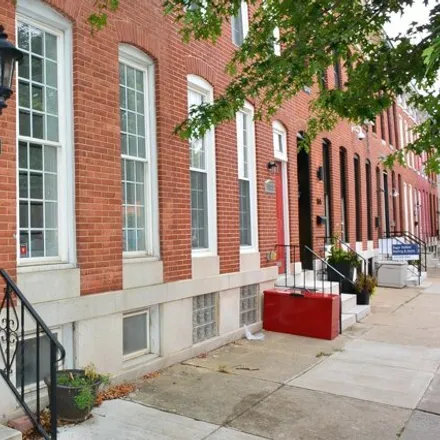 Rent this 3 bed townhouse on 1611 South Charles Street in Baltimore, MD 21230