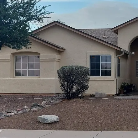 Buy this 4 bed house on 8898 North Soft Winds Drive in Pima County, AZ 85742