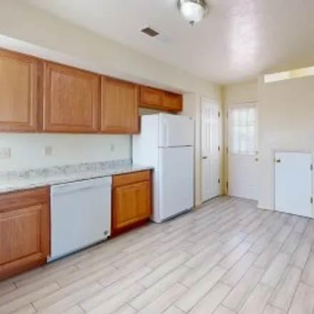 Rent this 3 bed apartment on 1604 Twinberry Drive Northeast in North Hills, Rio Rancho