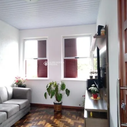 Buy this 2 bed apartment on Rua Tuparaí in Passo da Areia, Porto Alegre - RS