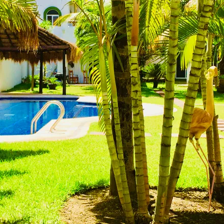 Rent this 4 bed house on CASA ALUM in Avenida Paseo Coba, Playacar Fase 1