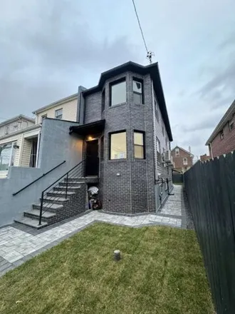 Buy this 3 bed house on 24-45 95th Street in New York, NY 11369