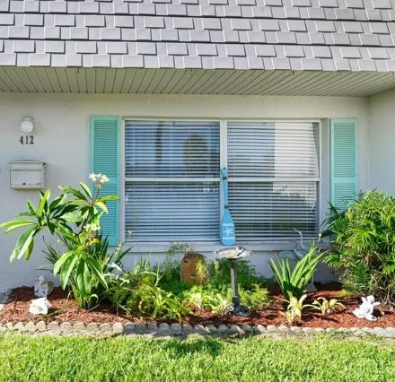 Rent this 3 bed house on 412 Dove Ln Unit 77 in Satellite Beach, Florida