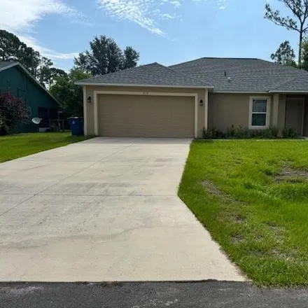 Rent this 3 bed house on 515 Holmes Ave NW in Palm Bay, Florida