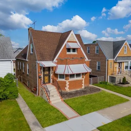 Buy this 4 bed house on 3447 North New England Avenue in Chicago, IL 60634