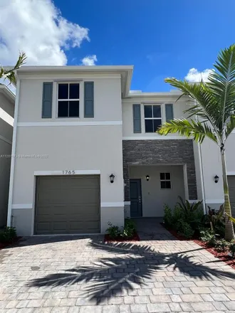Rent this 3 bed townhouse on 1765 Southeast 7th Terrace in Homestead, FL 33034