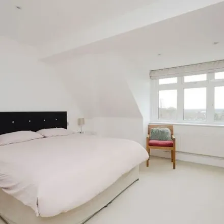 Rent this 4 bed townhouse on 172 Cottenham Park Road in London, SW20 0SY