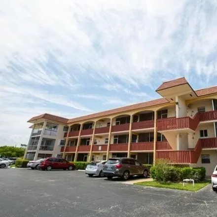 Rent this 2 bed condo on 687 Pine Drive in Cypress Isles Estates, Pompano Beach