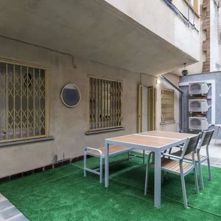 Rent this 7 bed apartment on Rambla de Badal in 08001 Barcelona, Spain