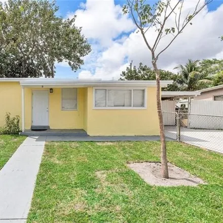 Buy this 5 bed house on 4871 NE 14th Ter in Pompano Beach, Florida