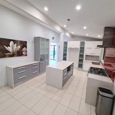 Rent this 3 bed apartment on Pine Road in Casula NSW 2170, Australia