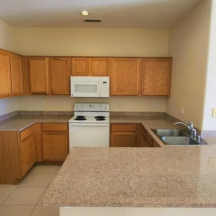 Rent this 3 bed apartment on 1842 North 112th Drive in Avondale, AZ 85392
