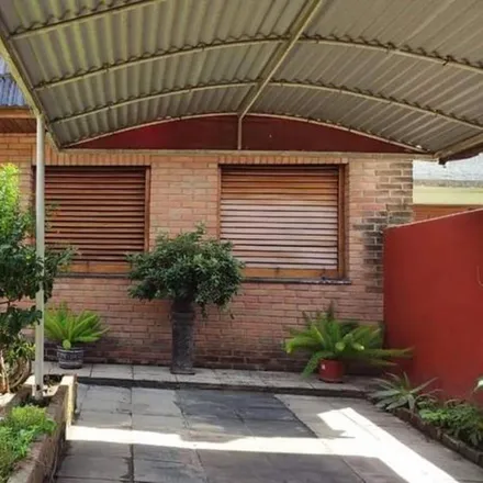 Buy this 3 bed house on Química Morón SRL in Avenida Hipólito Yrigoyen, Partido de Morón