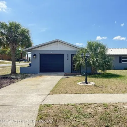 Rent this 2 bed house on 5260 Woodridge Lane in Spring Hill, FL 34609