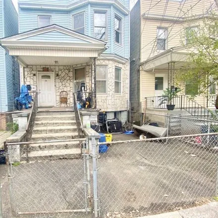 Rent this 3 bed house on 24 Fulton Avenue in Greenville, Jersey City