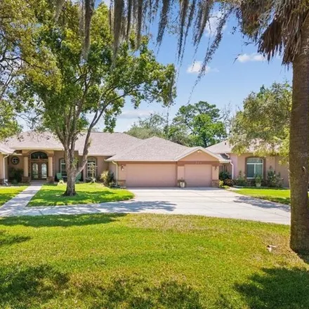 Buy this 5 bed house on 315 Cressida Circle in Spring Hill, FL 34609