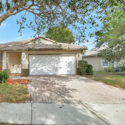 Buy this 3 bed house on 4954 Northwest 123rd Way in Heron Bay South, Coral Springs