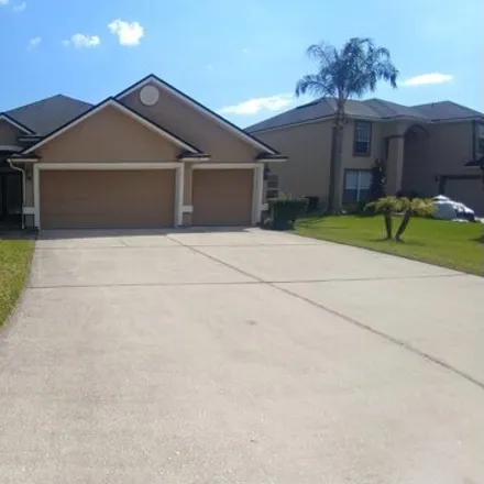 Rent this 4 bed house on 225 Mahogany Bay Drive in Fruit Cove, FL 32259