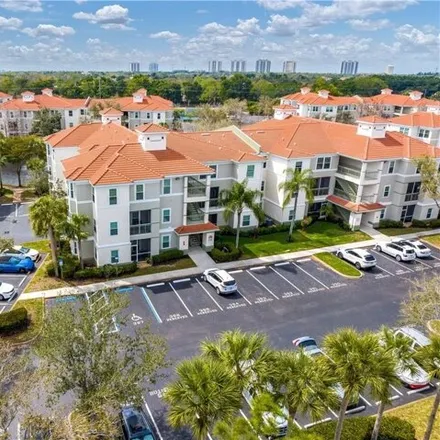 Buy this 2 bed condo on Walden Center Drive in Mirasol at Coconut Point, Lee County