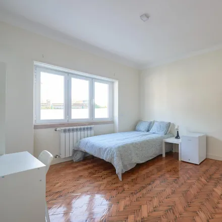 Rent this 14 bed room on Rua Carlos Malheiro Dias 11 in 1700-108 Lisbon, Portugal