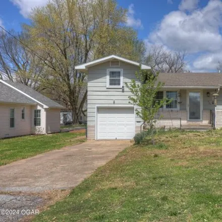 Buy this 4 bed house on 409 East 4th Street in Baxter Springs, KS 66713
