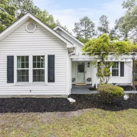 Buy this 3 bed house on 333 Tangle Oaks Court Southeast in Belville, NC 28451