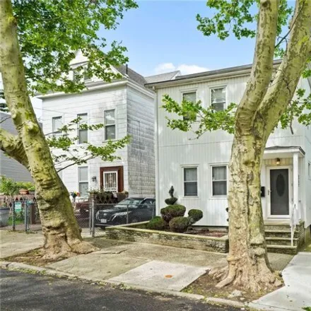 Buy this 4 bed house on 82-84 88th Place in New York, NY 11385
