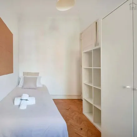 Rent this 7 bed room on Rua João de Menezes 13 in 1900-024 Lisbon, Portugal