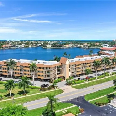 Buy this 2 bed condo on 672 West Elkcam Circle in Marco Island, FL 34145