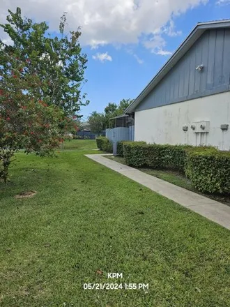 Rent this 3 bed townhouse on 2265 Timberlane Circle in Greenacres, FL 33463