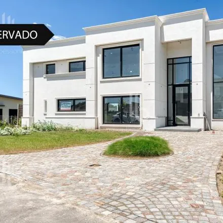 Buy this 4 bed house on unnamed road in Bosque de Peralta Ramos, B7603 DRT Mar del Plata