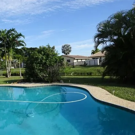 Buy this 4 bed house on 1885 Northwest 83rd Drive in Coral Springs, FL 33071
