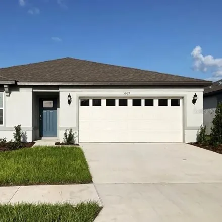 Rent this 4 bed house on 199 South Buena Vista Drive in Lake Alfred, Polk County