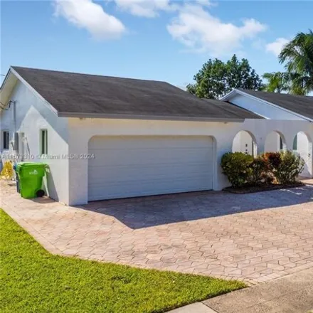 Rent this 4 bed house on 10546 Sunset Strip in Sunrise, FL 33322