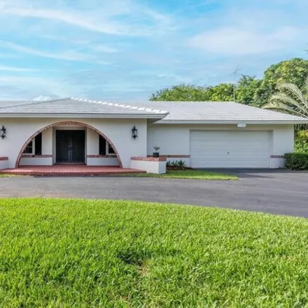 Rent this 3 bed house on 11758 Hermitage Drive in Plantation, FL 33325