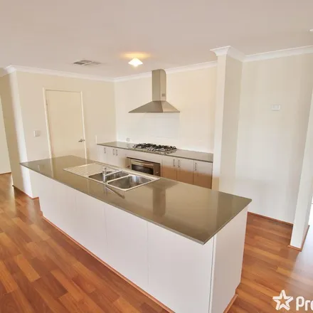 Rent this 4 bed apartment on 63 Flametree Boulevard in Harrisdale WA 6112, Australia