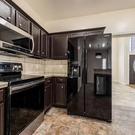 Rent this 4 bed apartment on 1105 Creekbluff Drive in Carrollton, TX 75010