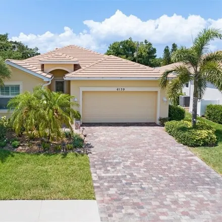 Buy this 4 bed house on 6123 Grand Cypress Boulevard in North Port, FL 34287