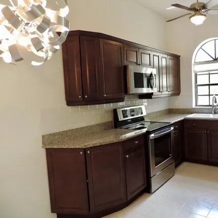 Rent this 3 bed condo on 5211 Brisata Circle in Country Club Trail, Palm Beach County