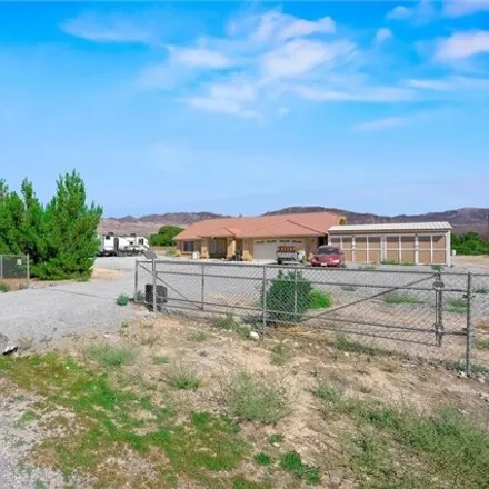 Buy this 4 bed house on 5101 North Holly Street in Pahrump, NV 89060