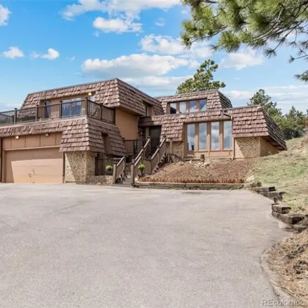 Buy this 6 bed house on 6624 South Kilimanjaro Drive in Jefferson County, CO 80439