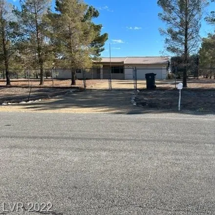Buy this 2 bed house on 2541 Papaya Avenue in Pahrump, NV 89048