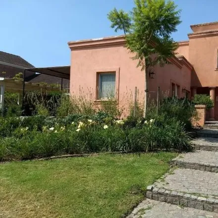 Rent this 4 bed house on unnamed road in Partido de Tigre, Troncos del Talar