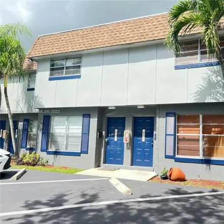 Rent this 2 bed townhouse on 4765 Northwest 9th Drive in Breezeswept Park Estates, Plantation