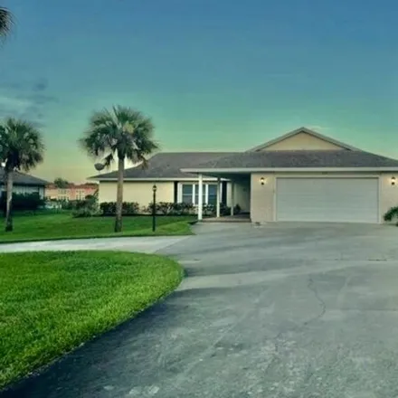 Rent this 3 bed house on American Golf Club in 100 Woodland Drive, Vero Beach