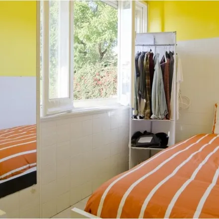 Rent this 8 bed room on Piscina de Arroios in Rua Maria da Fonte, 1170-220 Lisbon