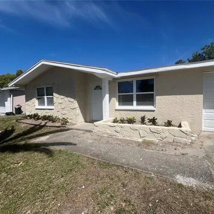 Rent this 2 bed house on 7437 King Arthur Drive in Jasmine Estates, FL 34668