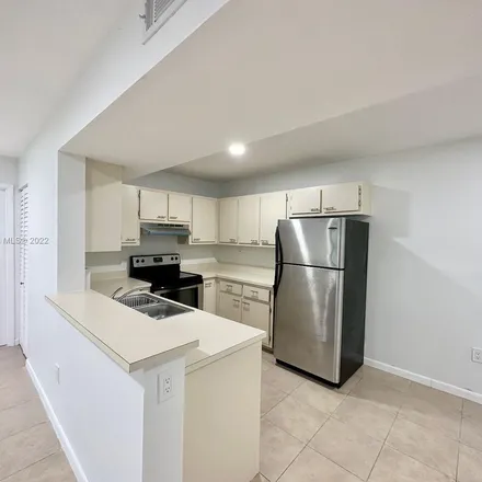 Rent this 2 bed apartment on 298 Palm Circle West in Pembroke Pines, FL 33025
