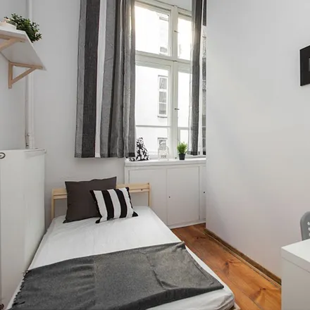 Rent this 4 bed room on Nowogrodzka 48 in 00-695 Warsaw, Poland