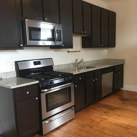 Rent this 2 bed apartment on 4954 N St Louis Ave